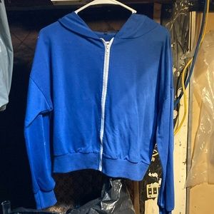 Blue zip-up jacket.